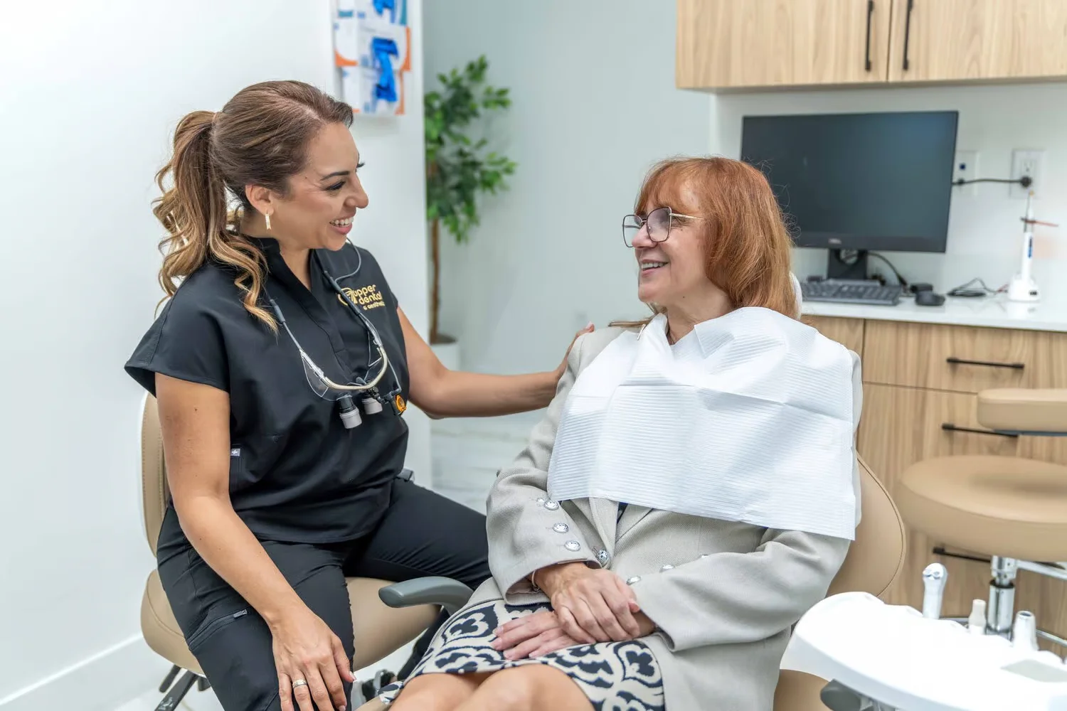 Upper Dental doctor comforting patient